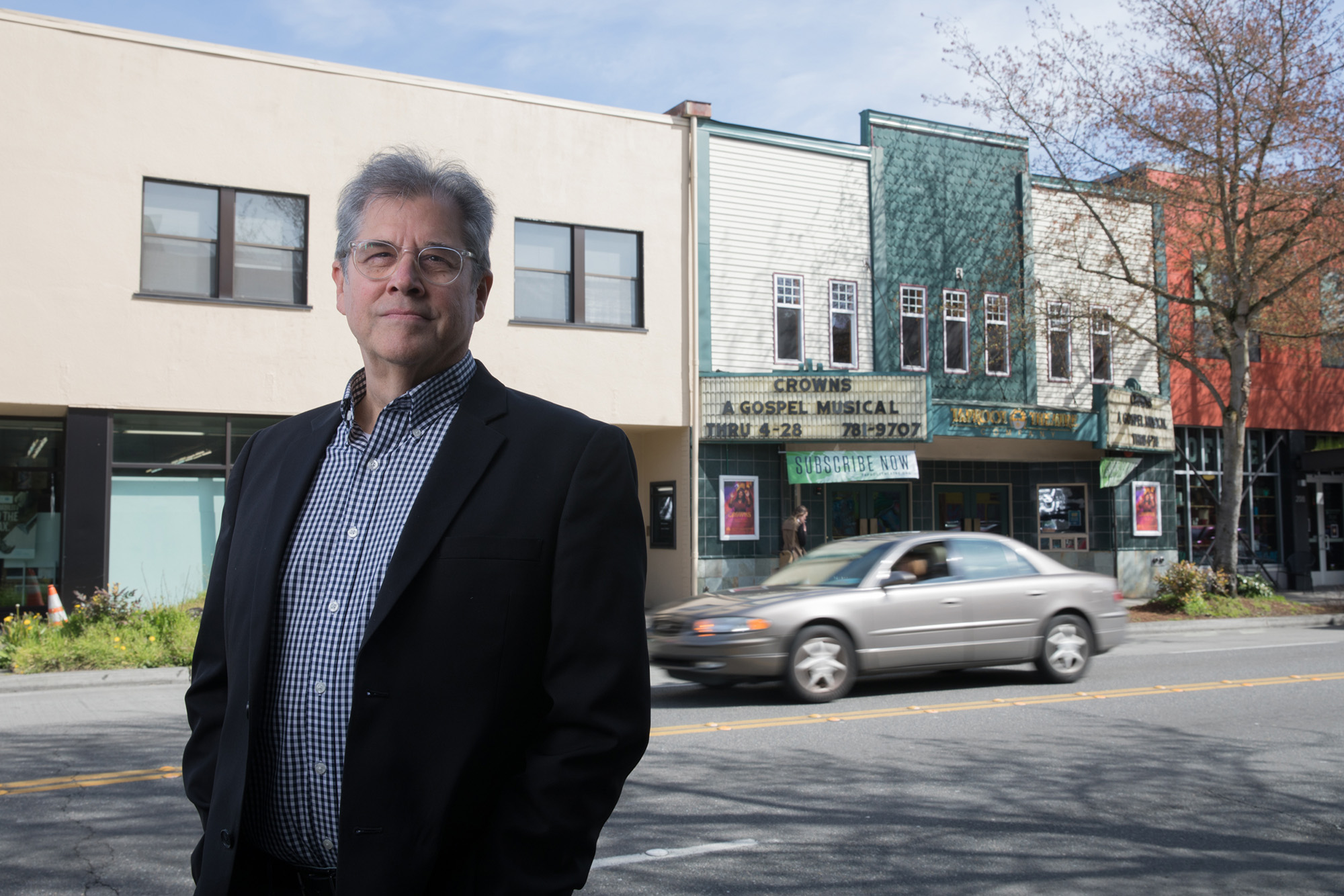 Scott Nolte, president, CEO and producing artistic director of the Taproot Theatre Company, stands for a portrait across the street from the theater off Greenwood Avenue and North 85th Street in Seattle.