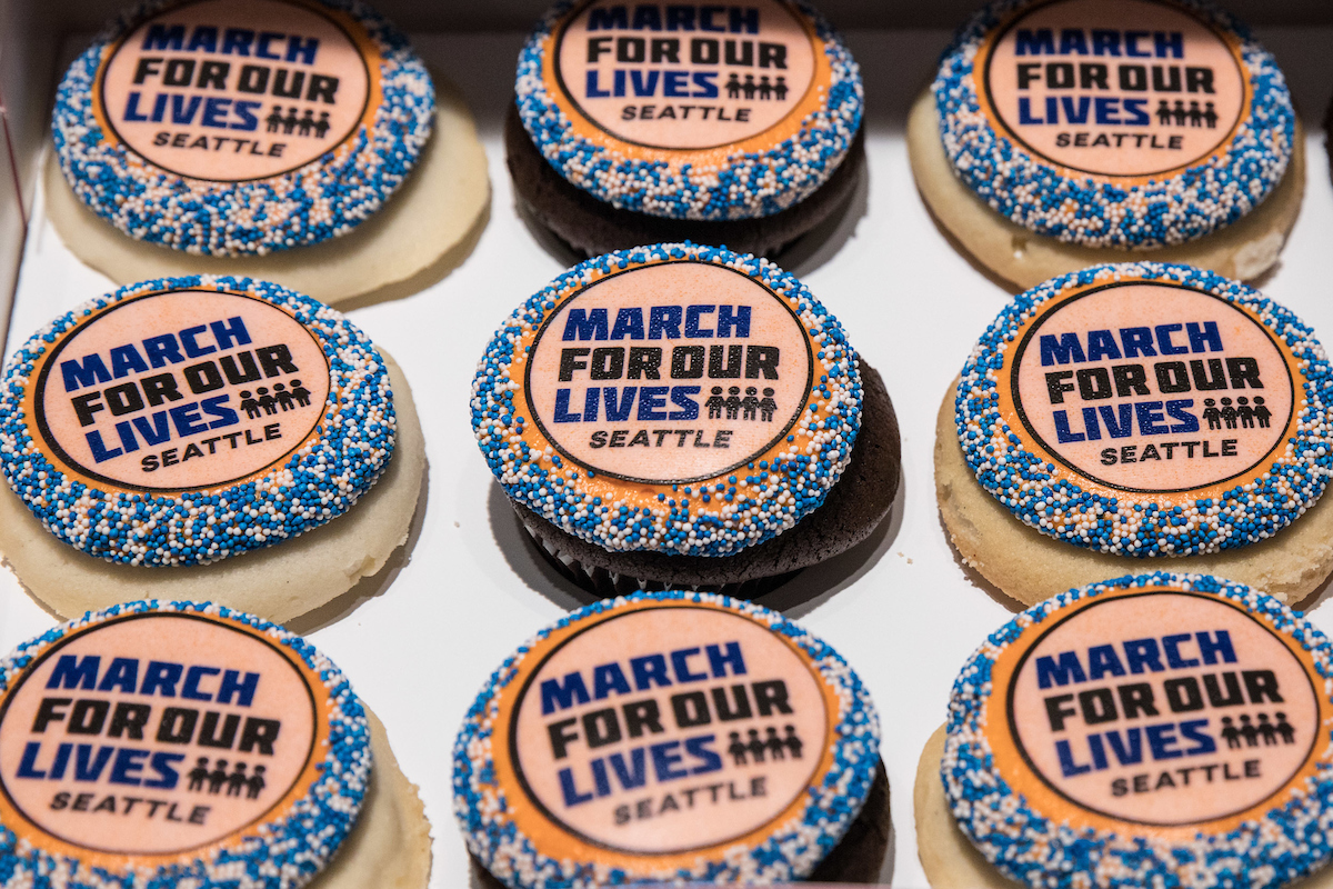 Cupcakes are adorned with the Seattle March For Our Lives logo