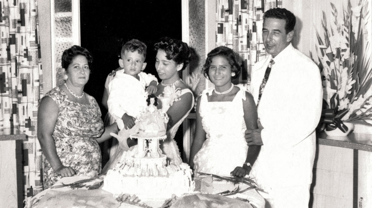 With family. From left to right: Juan Alonso-Rodriguez’s mother, Juan as a child in Cuba, Juan's two sisters, and his father. Photo Courtesy: Juan Alonso-Rodriguez