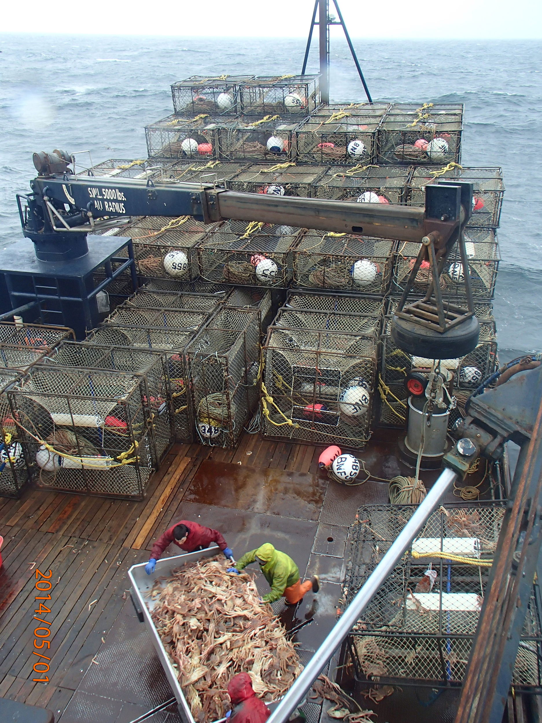 Crab traps stacked on a boat deck