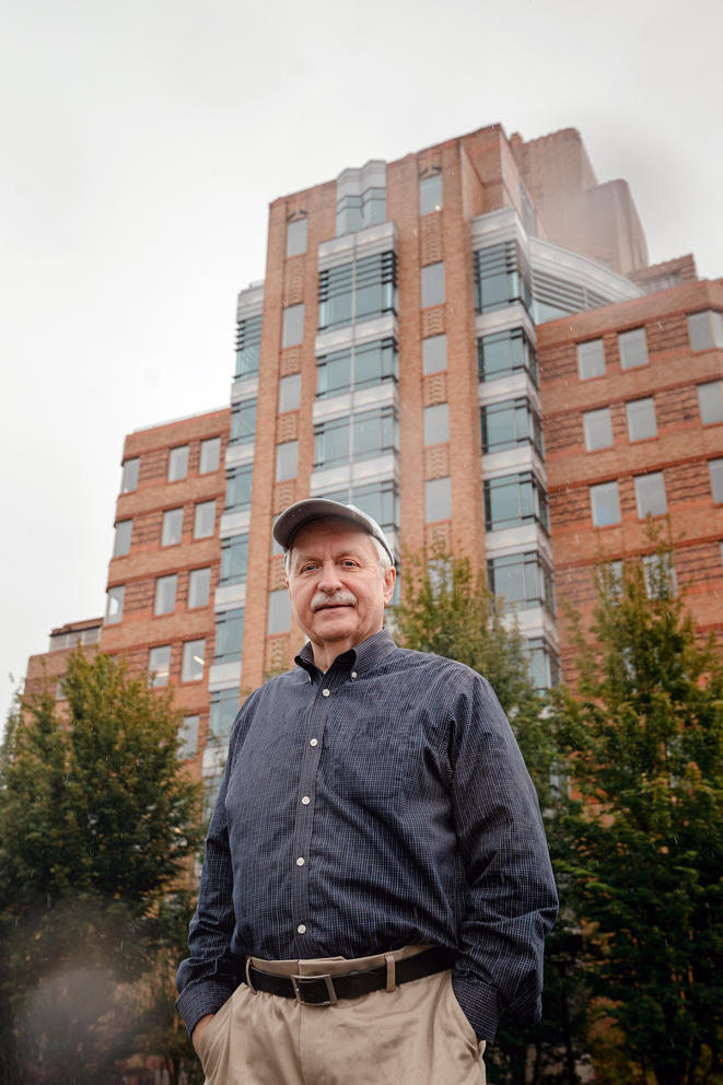 Frank Chopp stands outside of Pacific Tower