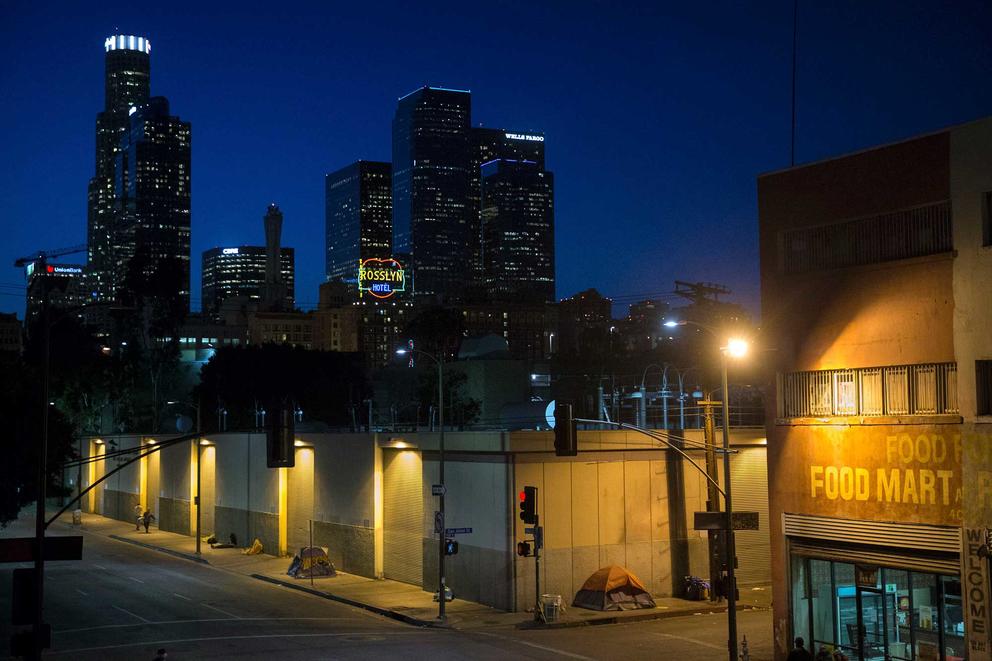 In this April 25, 2016, file photo, homeless people sleep in the Skid Row area of downtown Los Angeles. (AP Photo/Jae C. Hong, File)