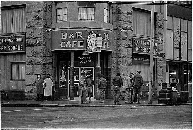 People standing in front of B & R Cafe