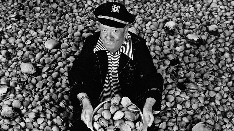 Ivar Haglund surrounded by acres of clams