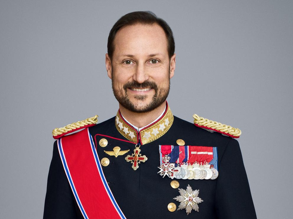 Norwegian Crown Prince Haakon smiles into the camera for a portrait