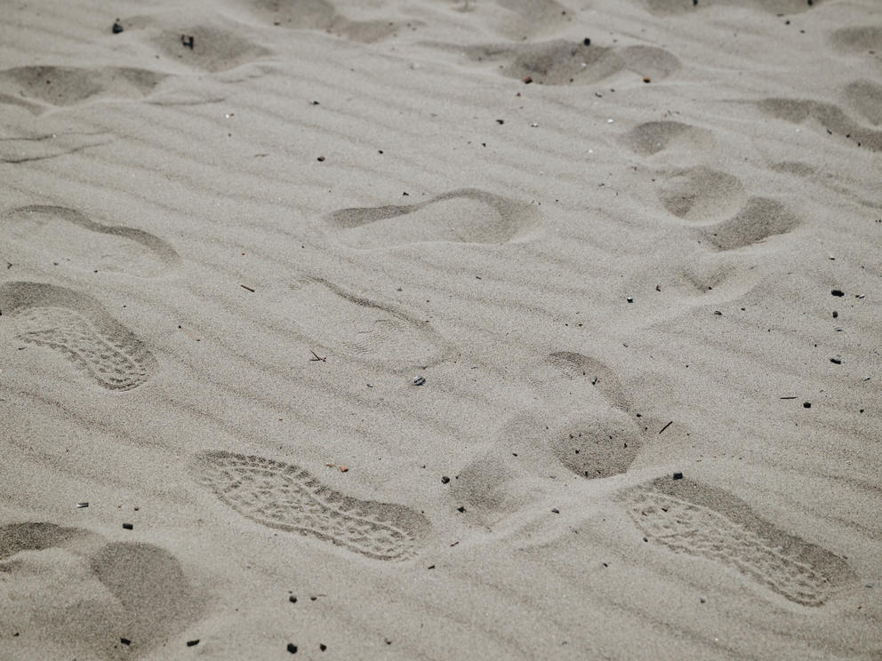 footprints on a sandy beach
