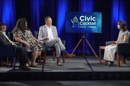four people sit on a stage in front of a graphic reading Civic Cocktail.