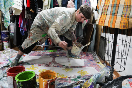 Artist Janelle Abbott works on an outfit