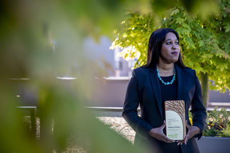 Patience Malaba holds the 2020 Bullitt Environmental Prize near her home in Seattle.