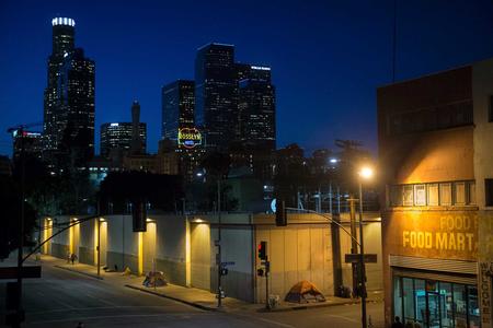 FILE - In this April 25, 2016, file photo, homeless people sleep in the Skid Row area of downtown Los Angeles. (AP Photo/Jae C. Hong, File)