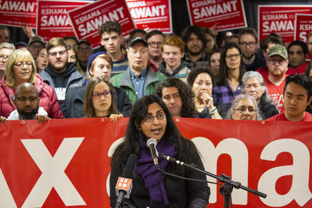 Seattle City Councilmember Kshama Sawant addresses members of the media