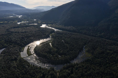 A river winds through a wooded valley.