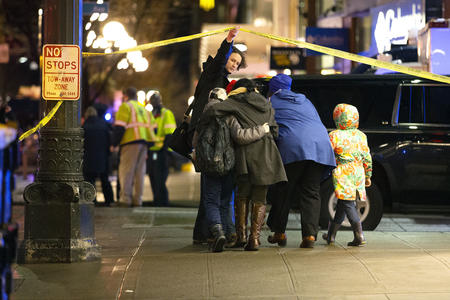 Family embrace near crime scene