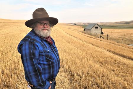 Host Knute Berger stands in a Palouse wheat field.