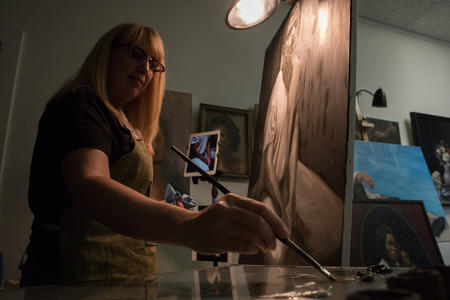 Andrea Gahl paints a portrait in her Sodo studio