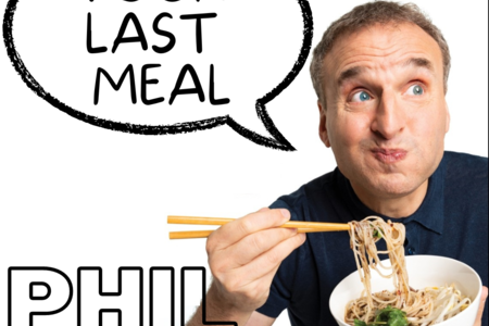 A man eats noodles with chopsticks
