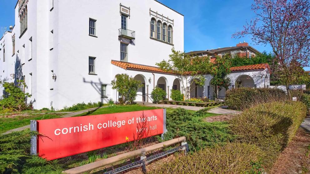 photo of a Colonial Spanish Revival building with a red sign reading Cornish College of the Arts