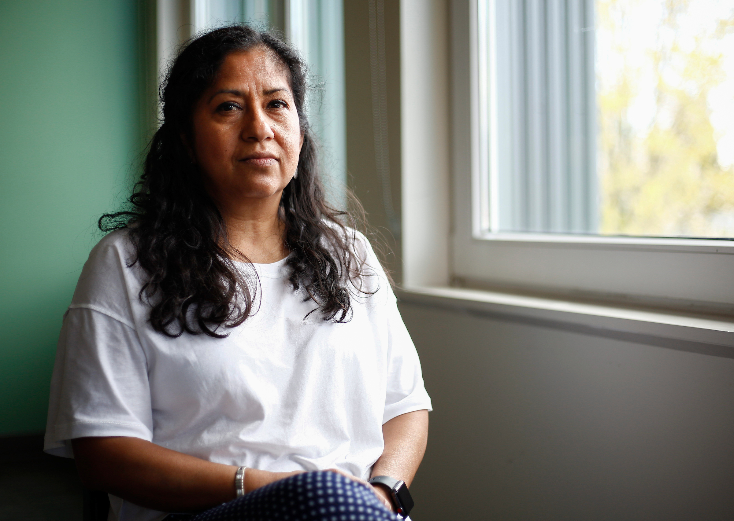 Community organizer and domestic worker Silvia Gonzalez poses for a portrait at Casa Latina in Seattle on Tuesday, April 10, 2018. 