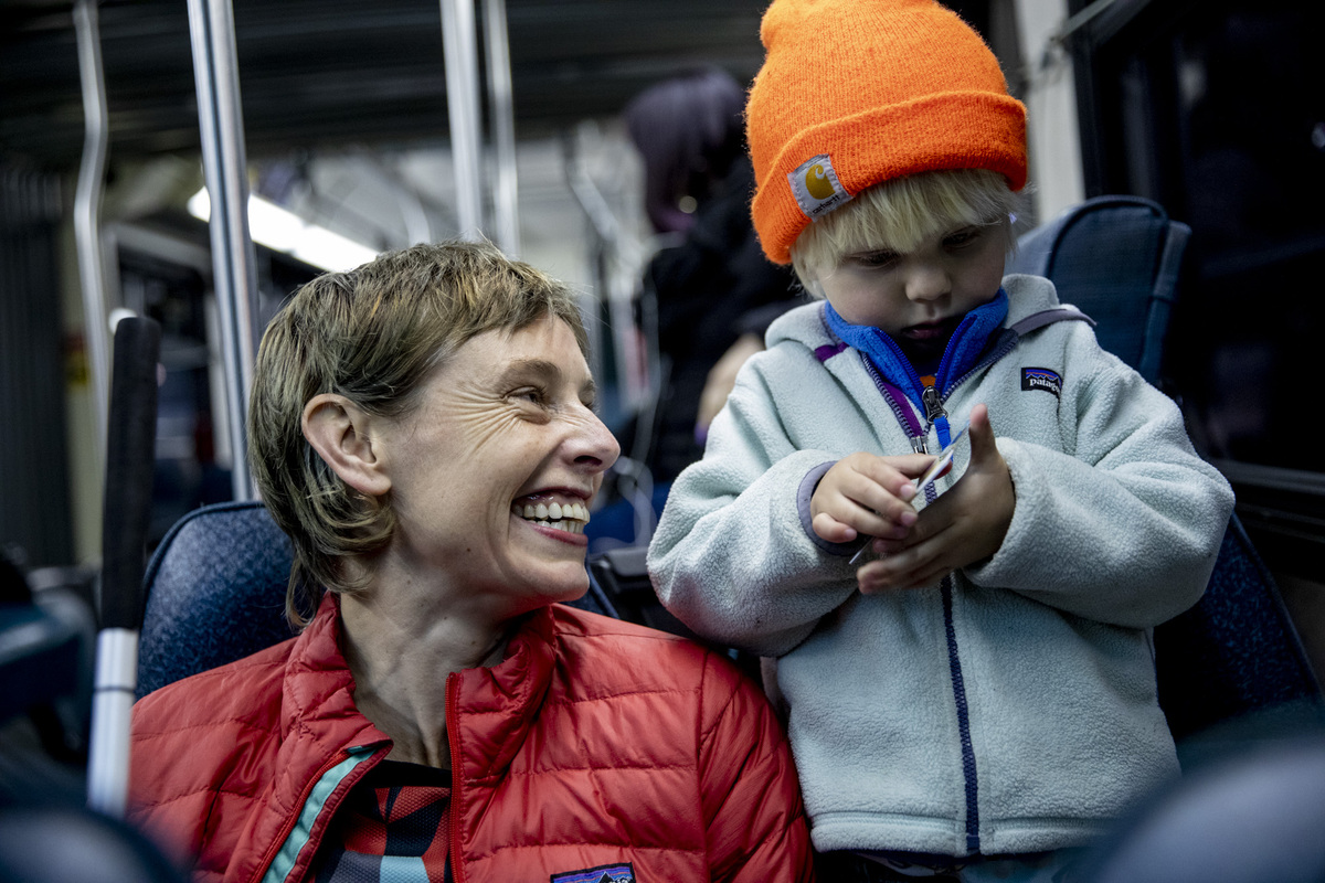 Anna Zivarts in a bus with her son