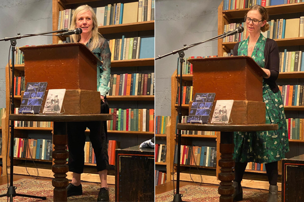 Two women reading at a podium