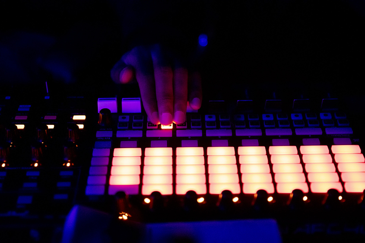 Fingers on a synth touch pad.
