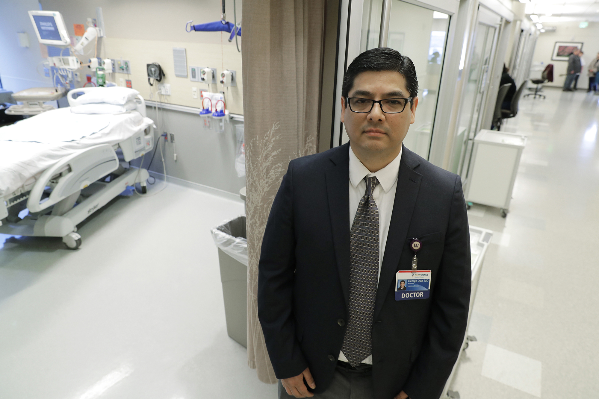 Dr. George Diaz, section chief for infectious diseases at Providence Regional Medical Center, poses for a photo in Everett, Wash, Jan. 23, 2020. Diaz was part of the team that treated the first U.S. patient infected with the new virus from China, who was admitted to the facility on Jan. 20, 2020. The hospital released a statement Monday, Feb. 3, 2020, from the unidentified 35-year-old man that said he has left the hospital and is now in isolation at home, and will be monitored by officials with the Snohomish Health District in coordination with the hospital. (Ted S. Warren/AP)