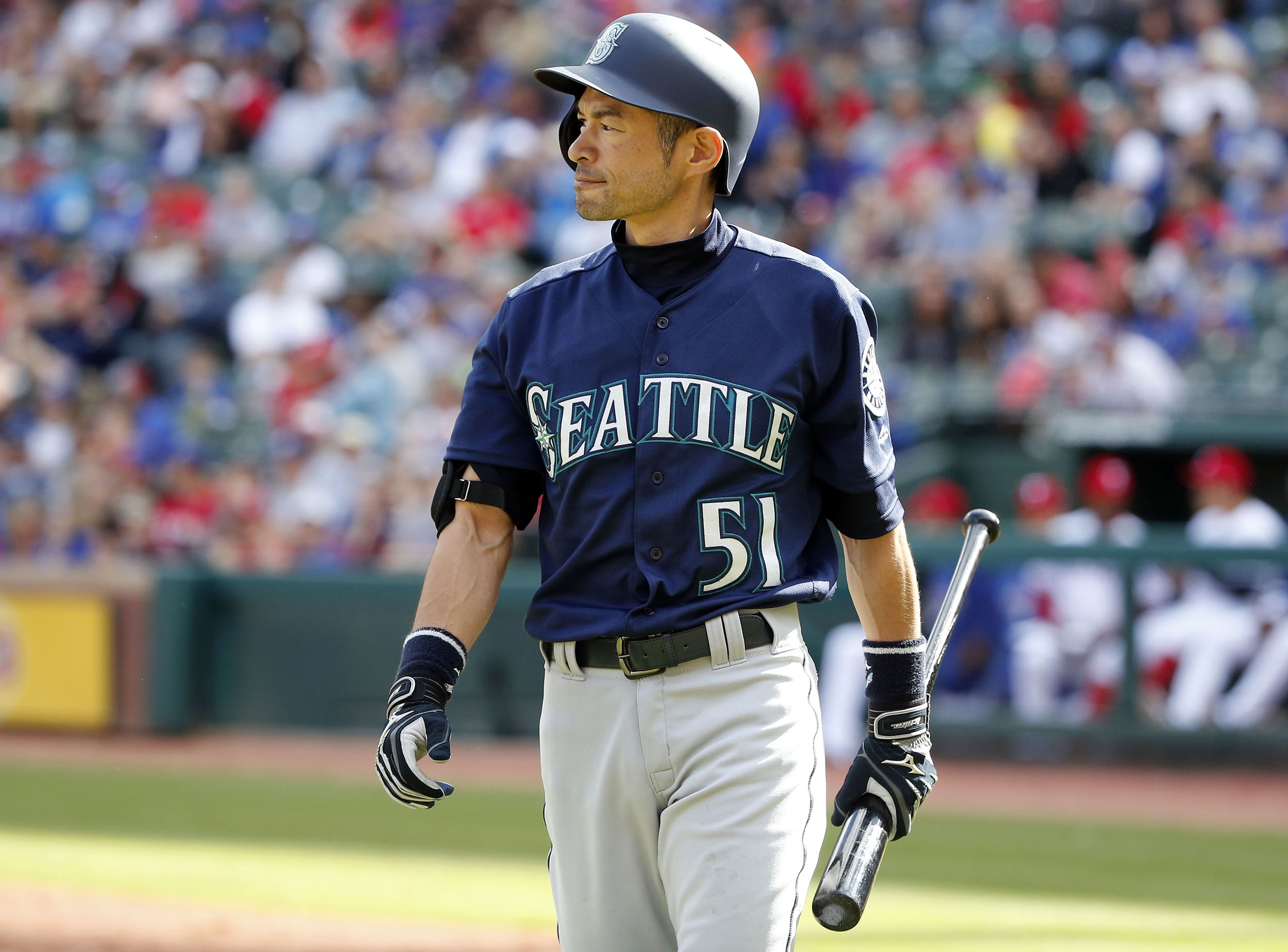 Seattle Mariners right fielder Ichiro Suzuki (51) walks back to the dugout after striking out against the Texas Rangers during the ninth inning of a baseball game Sunday, April 22, 2018, in Arlington, Texas. The Rangers defeated the Mariners 7-4. (AP Photo/Michael Ainsworth)