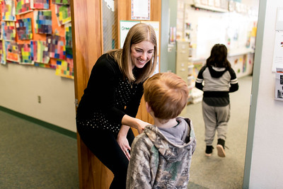 Reinforcing the value of eye contact and a handshake, Camille Jones greets every student by name each day.