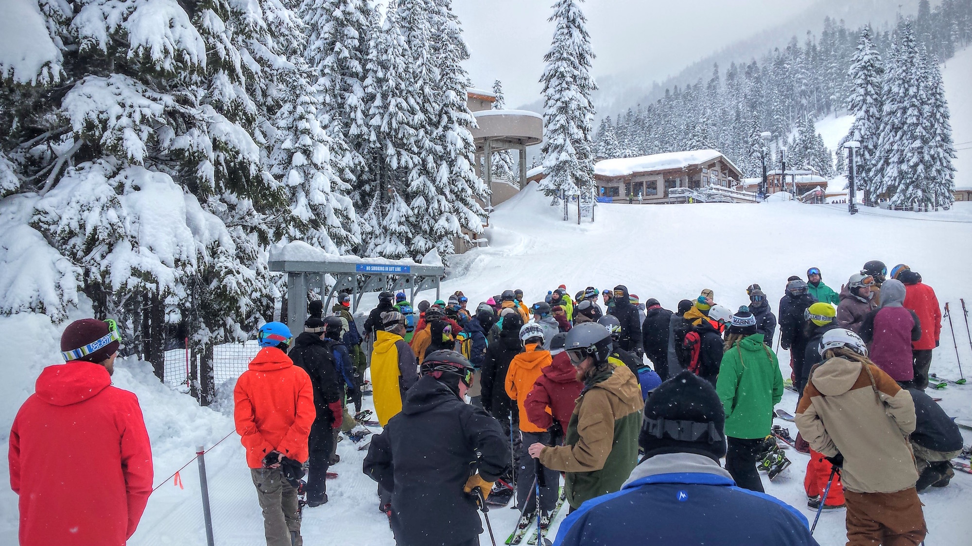 A crowd of skiers and snowboarders at Stevens Pass.