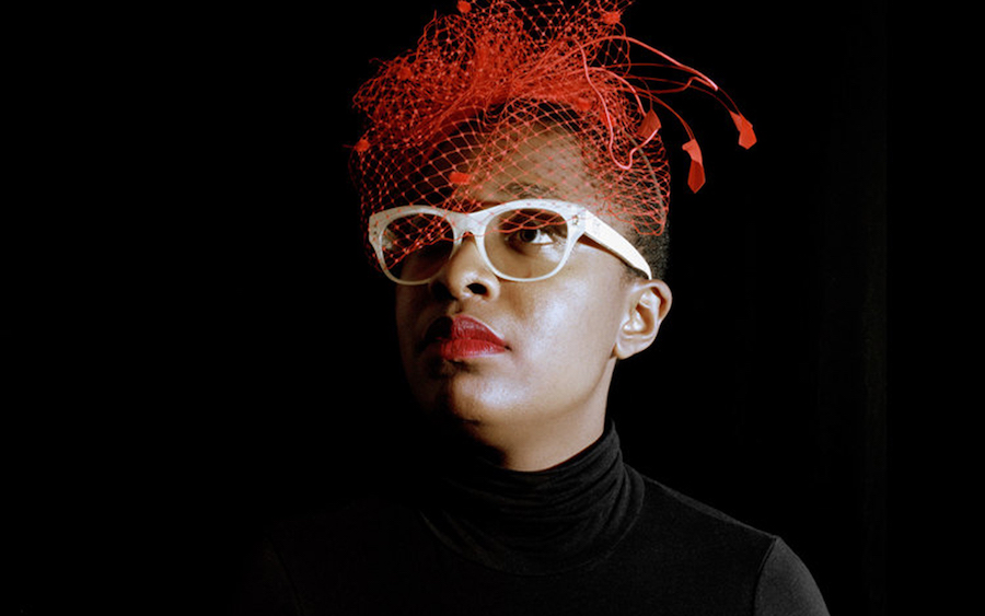 cecile mclorin salvant in a red hat