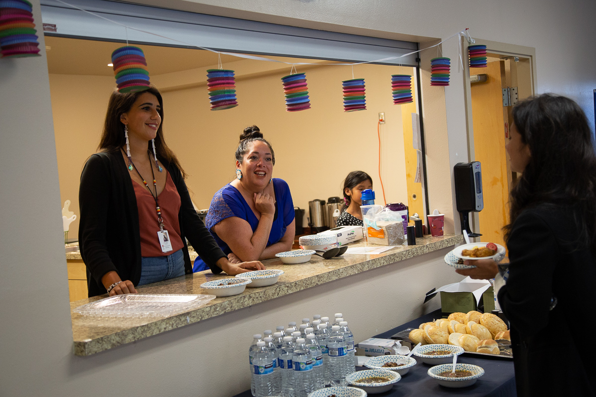 Urban Indian Health Institute evaluator Sofia Locklear (left) and Director Abigail Echo-Hawk (center) chat with Brooke Pinkham, Staff Director for Seattle University's Center for Indian Law & Policy, at a native community gathering at the Seattle Indian Health Board on July 18, 2019.