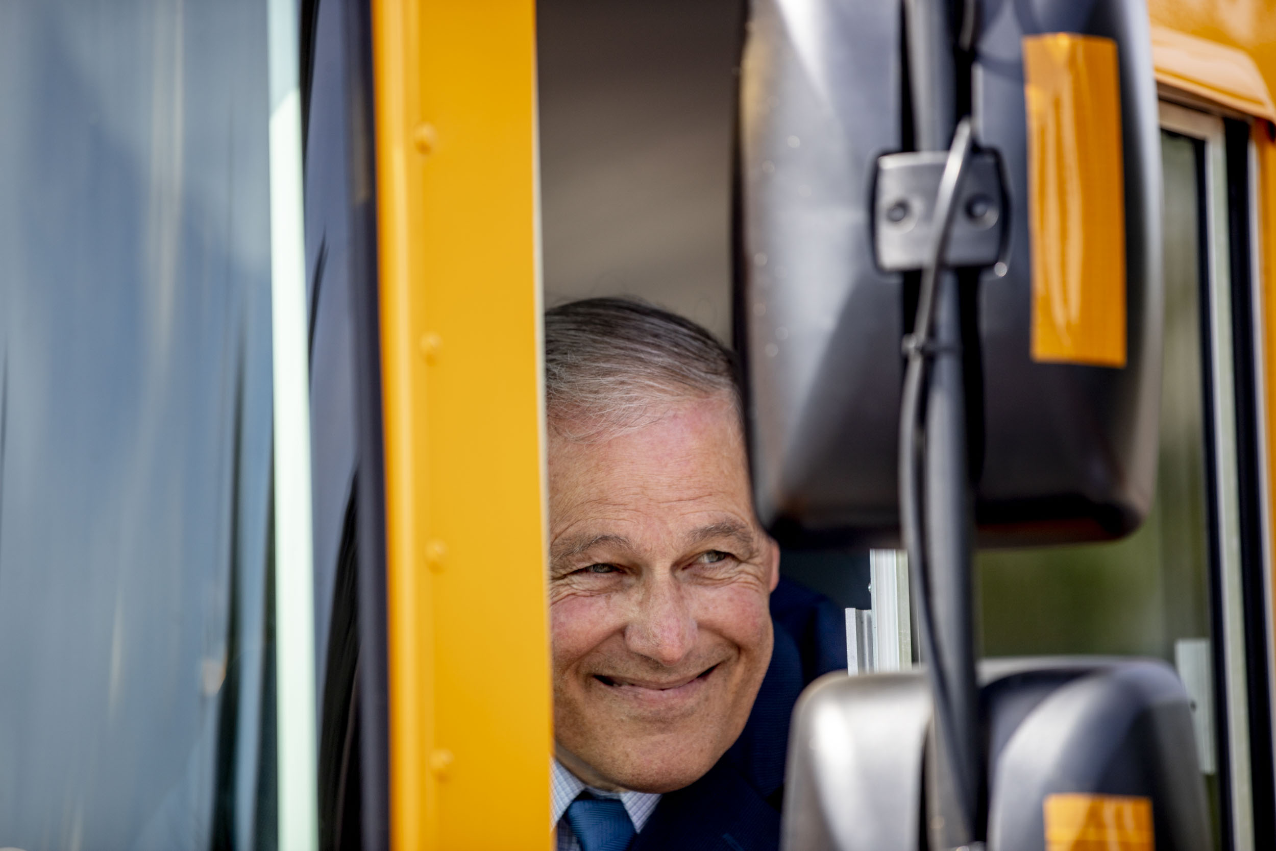 Governor Jay Inslee inside the first electric school bus in Washington state during an event at Franklin Pierce High School in Tacoma on June 17, 2019. (Photo by Dorothy Edwards/Crosscut)