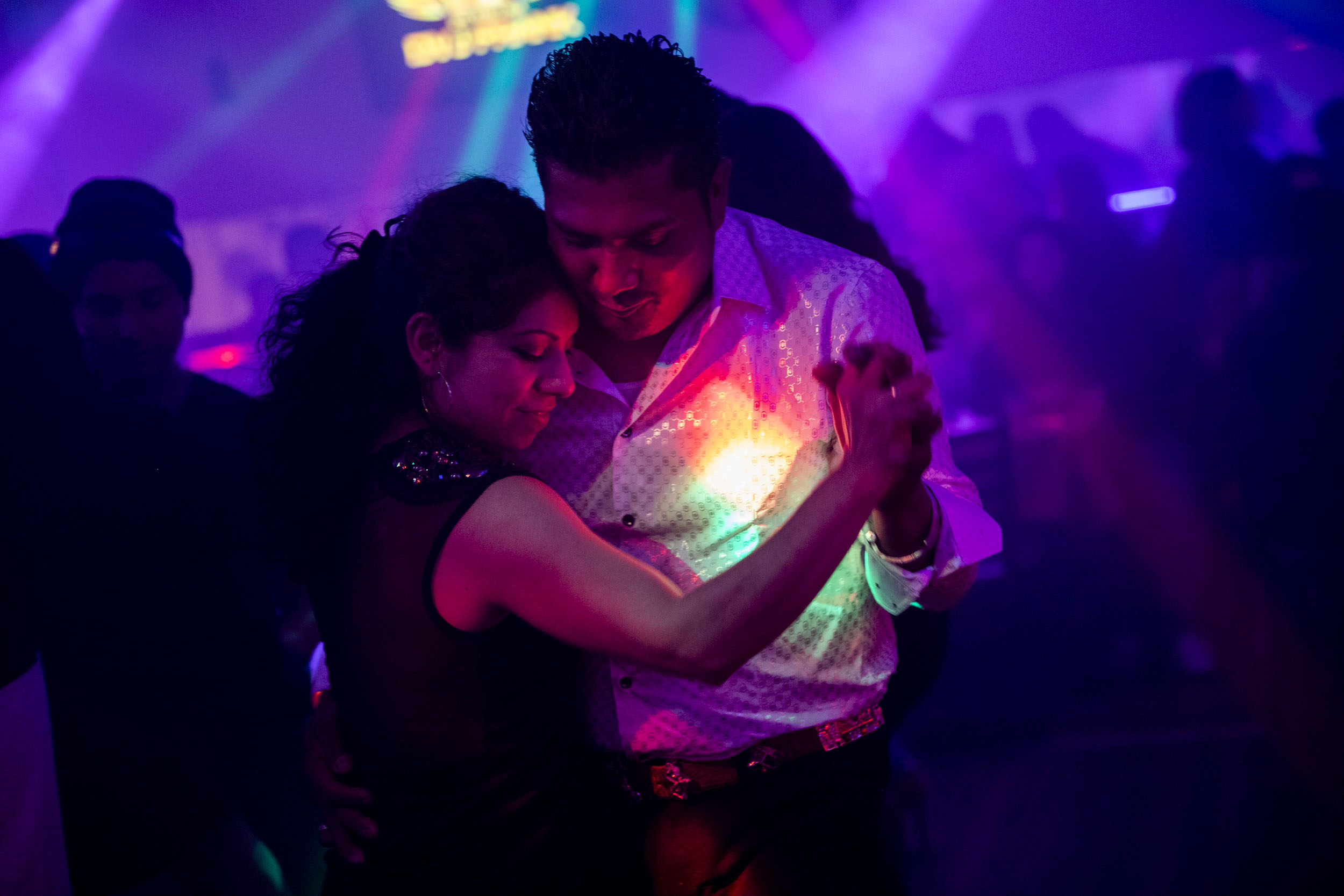 Couples take to the dance floor as DVJ Frank spins Latin music, including cumbia, at El Pique in Burien on April 6. (Photo by Dorothy Edwards/Crosscut)