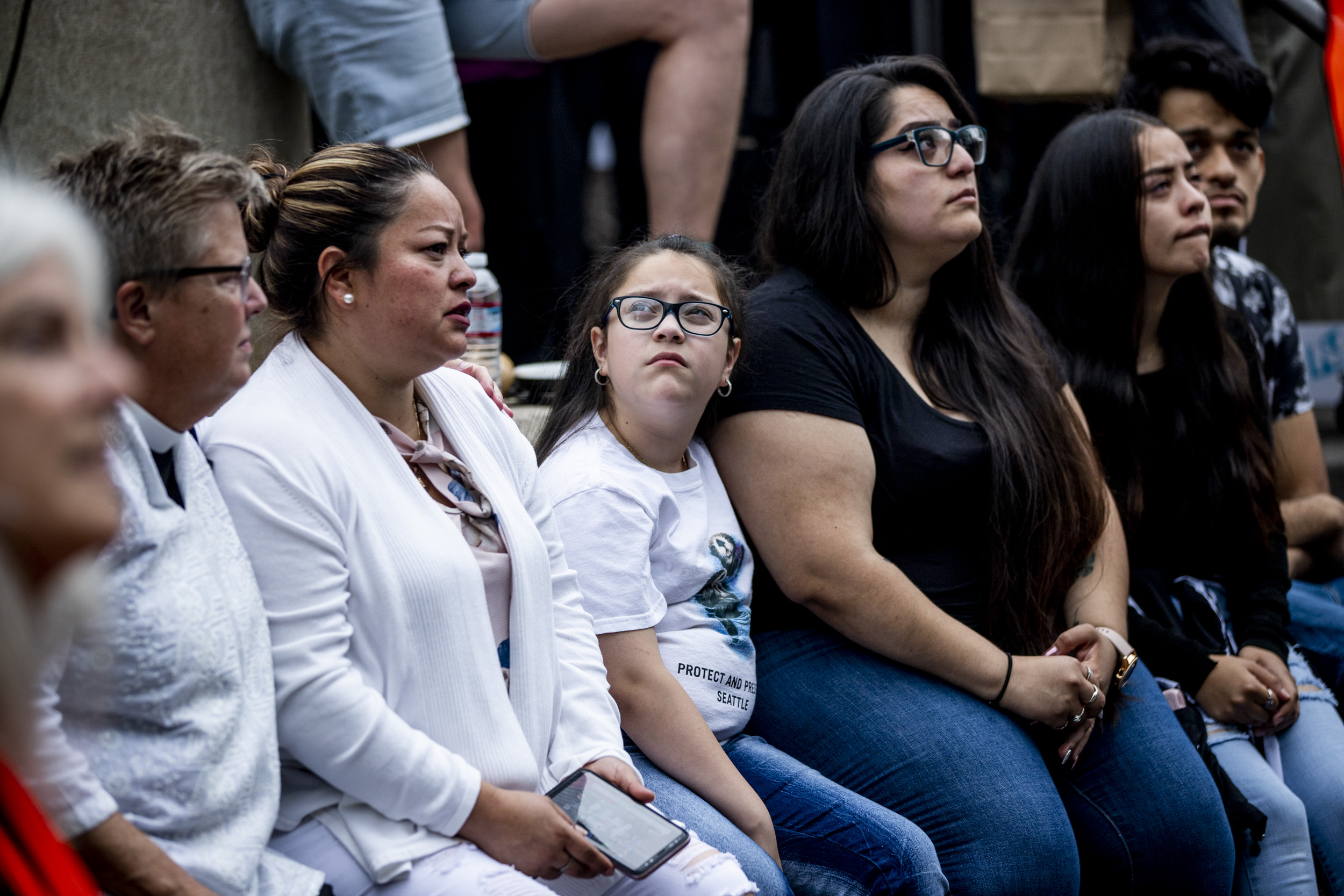 Family members of Jose Robles wait outside ICE offices in Tukwila to hear if Robles will be granted the stay of removal he requested on July 17, 2019. (Photo by Dorothy Edwards/Crosscut)