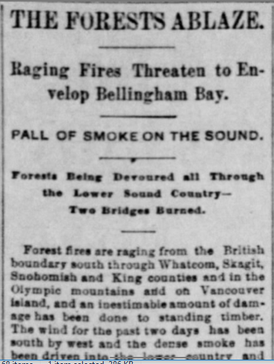 A newspaper clipping about a wildfire. The headline reads: "The forests ablaze. / Raging fires threaten to envelop Bellingham Bay"