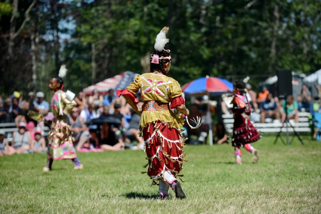 Girl dances during powwow