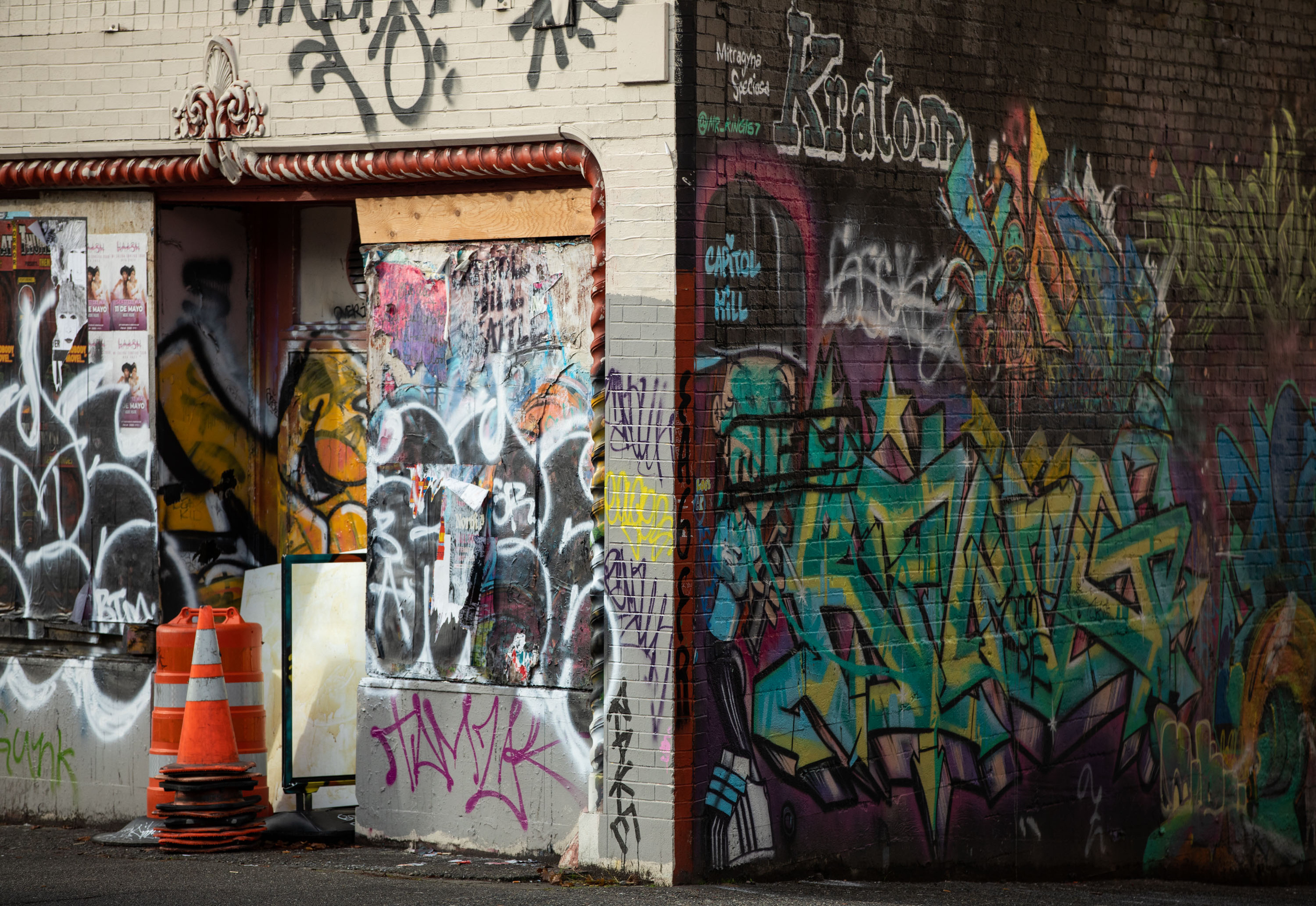 graffiti covered walls on a street corner