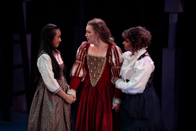 three actresses in renaissance costumes