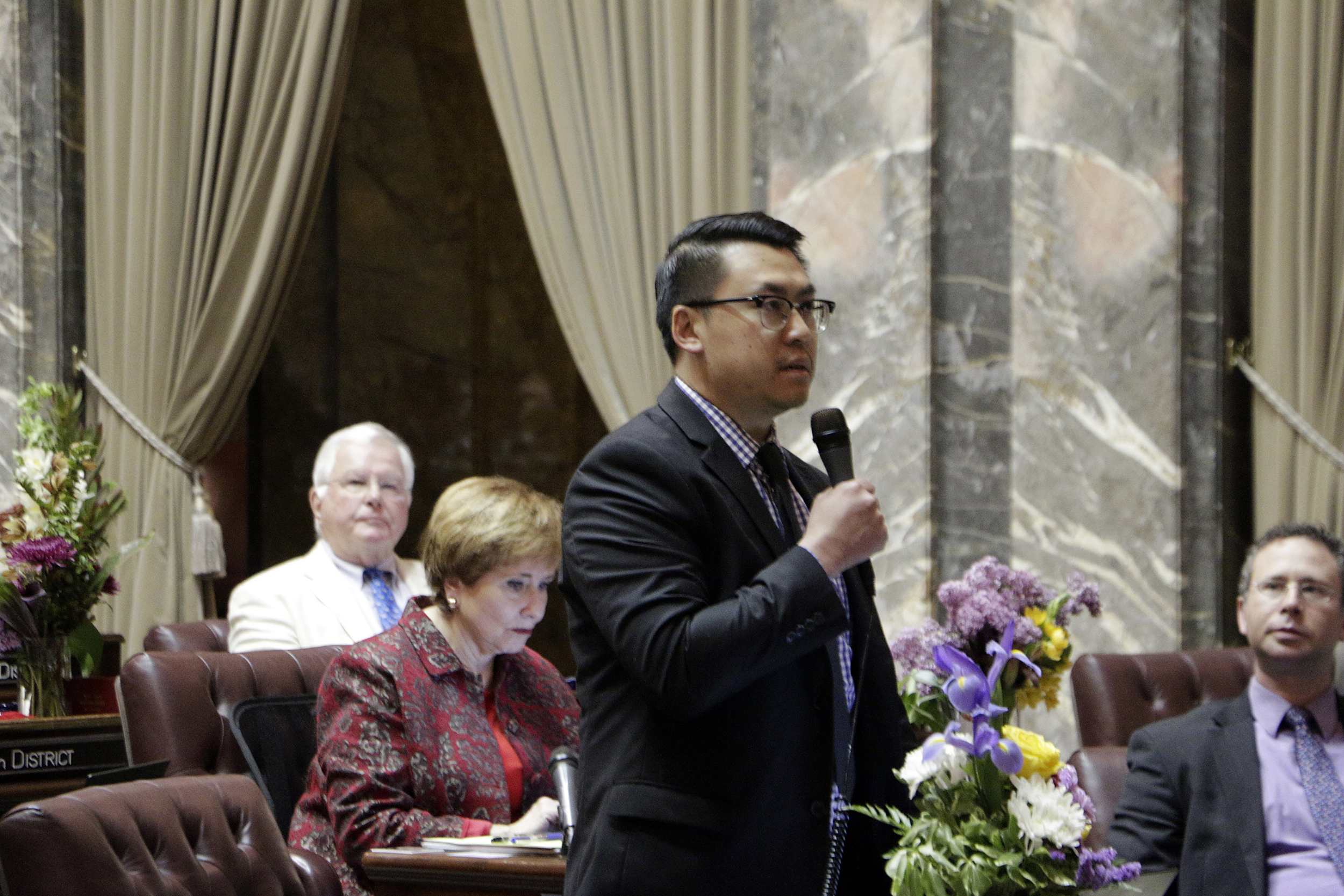 Democratic Sen. Joe Nguyen speaks in support of an initiative to the Legislature that would allow the state to use hiring and recruitment goals, but not quotas, to bring minority candidates into state jobs and education, on April 28, 2019, in Olympia. The measure loosens restrictions enacted in a 1998 initiative that banned government discrimination or preferential treatment based on factors such as race or gender. (Photo by Rachel La Corte/AP)