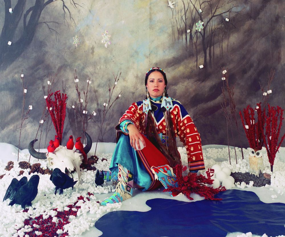 fake winter scene with woman dressed in stereotypical Native garb