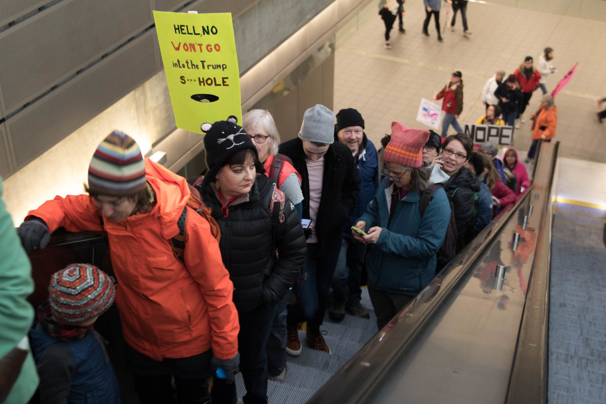 Protesters ride the escalator to the top of Capitol Hill Light Rail station and onward to the Seattle Women’s March 2.0 in Seattle, Jan. 20, 2018.