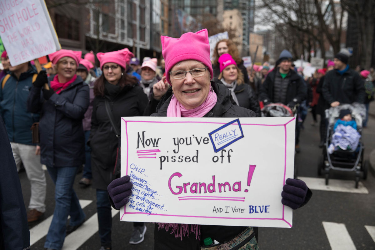 Marla Donaldson of Mercer Island marches holds up her sign during the Seattle Women’s March 2.0 in Seattle, Jan. 20, 2018.