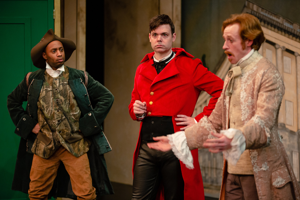 three men in Restoration comedy costumes