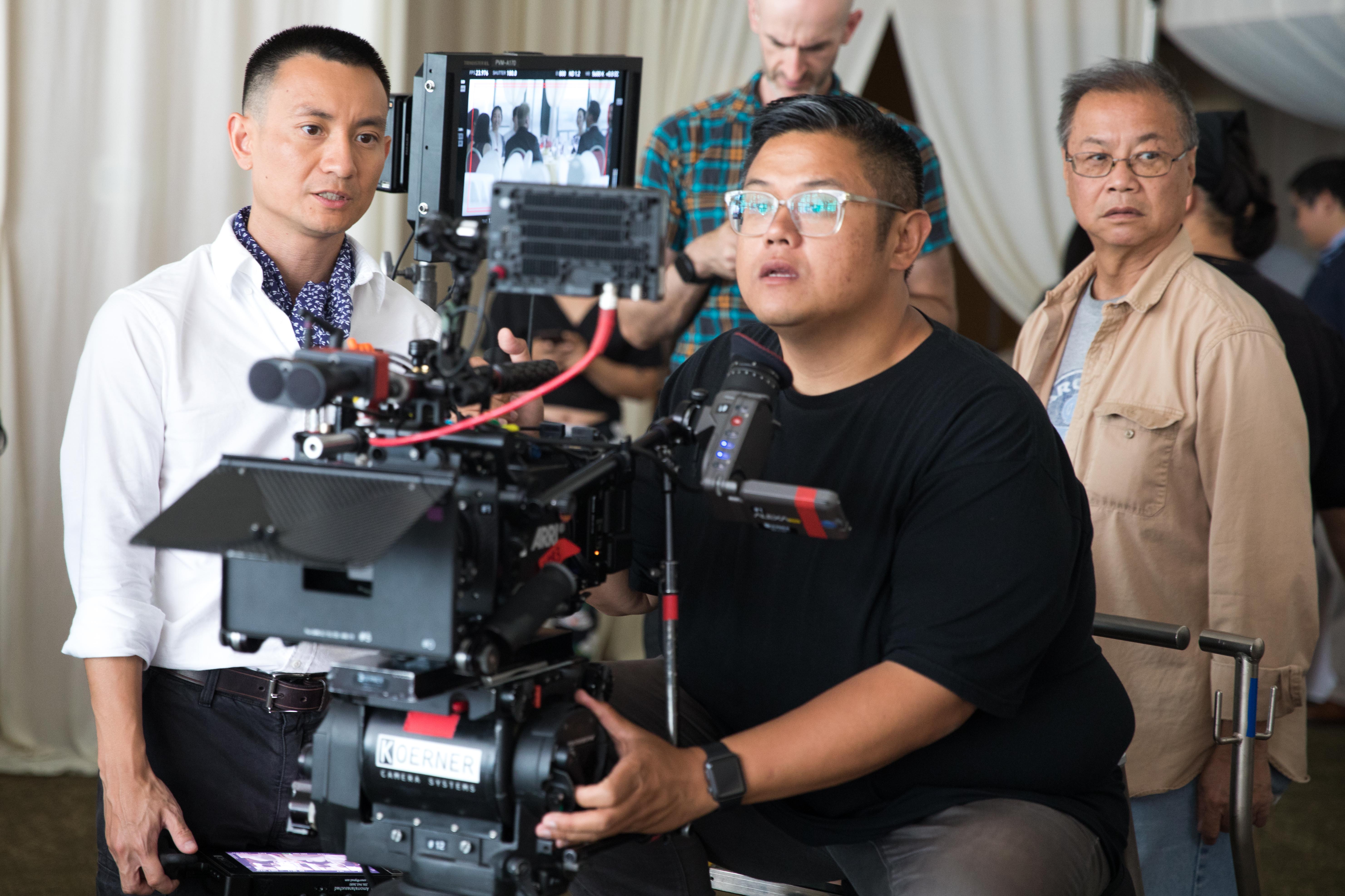 Bao Tran and director of photography filming at China Harbor