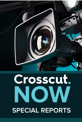 A close shot of a camera lens with Crosscut Now: Special Reports text underneath.