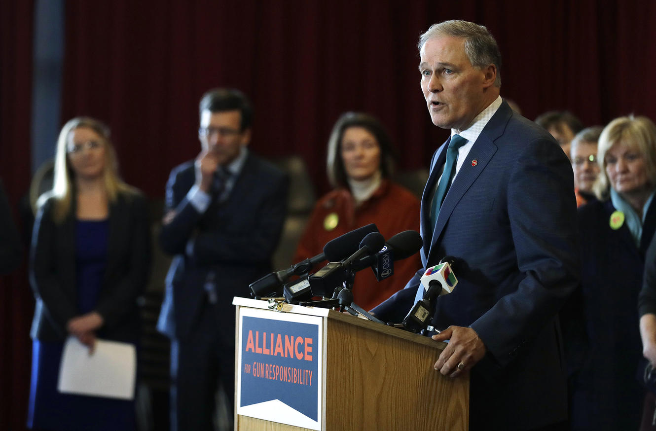 Washington Gov. Jay Inslee speaks Thursday, Feb. 14, 2019, in Seattle at an event held by the Alliance for Gun Responsibility to mark the one-year anniversary of the shooting at Marjory Stoneman Douglas High School in Parkland, Florida, and to talk about efforts in Washington state to reduce gun violence.