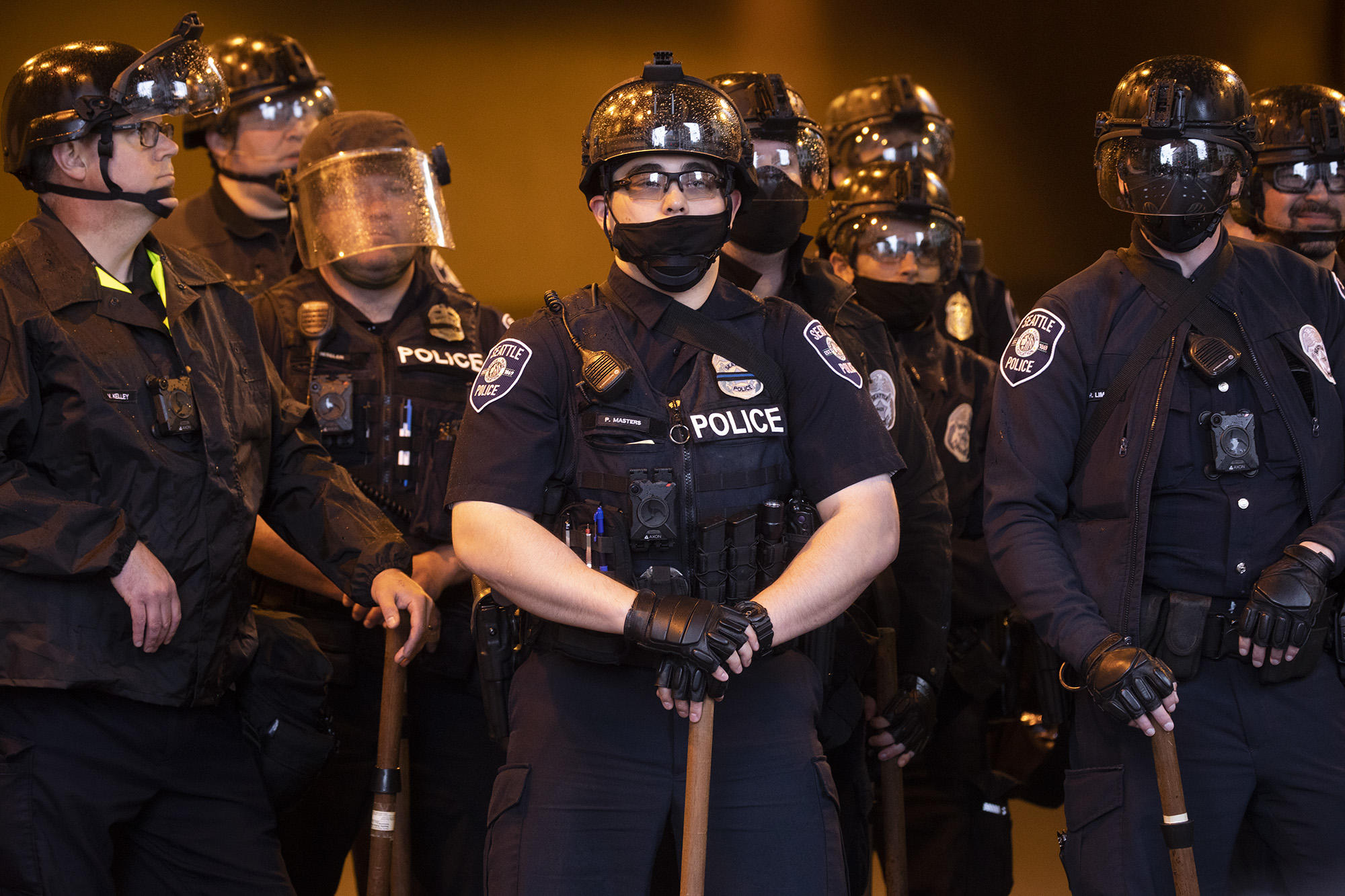 Seattle Police Department officers stand near a downtown onramp to Interstate 5 during protests across downtown Seattle in the aftermath of the killing of George Floyd by Minneapolis police, May 30, 2020. (Matt M. McKnight/Crosscut) 