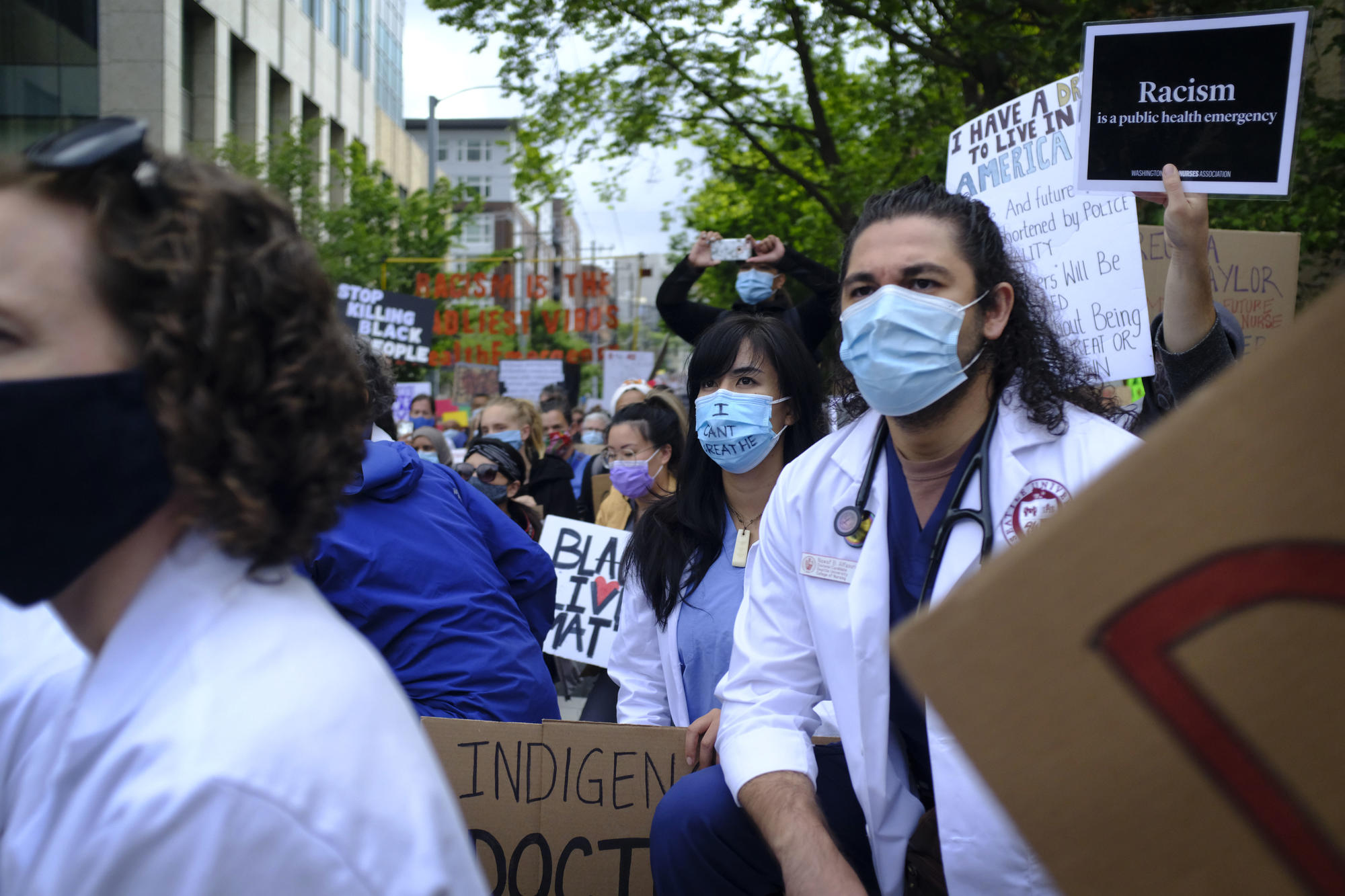 doctors kneel at march