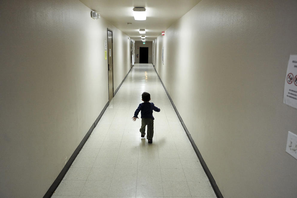 A child walking in a hallway