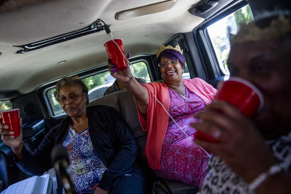 Grandmothers cheers in a stretch Hummer